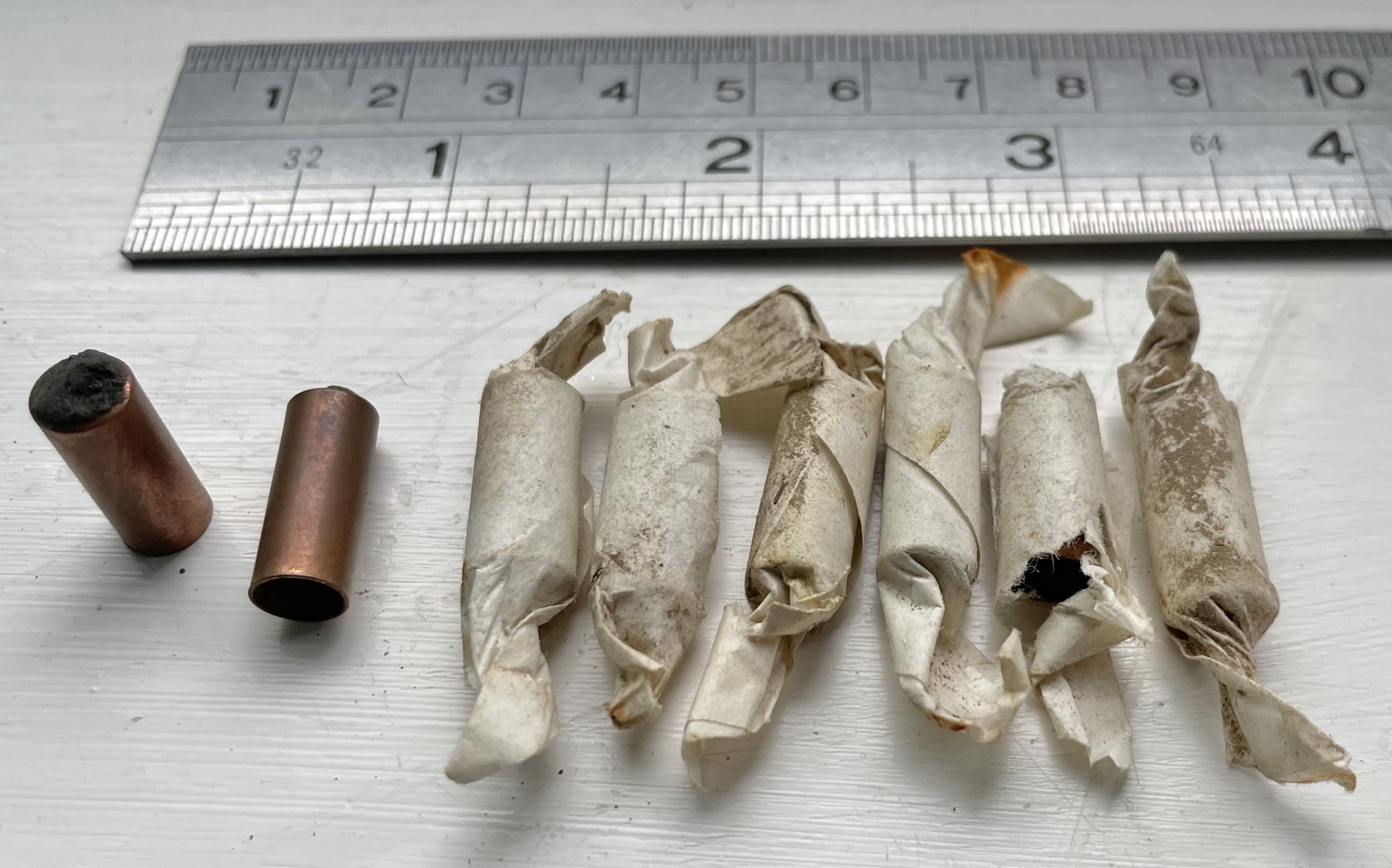 Copper tube igniters in wax paper wrappers