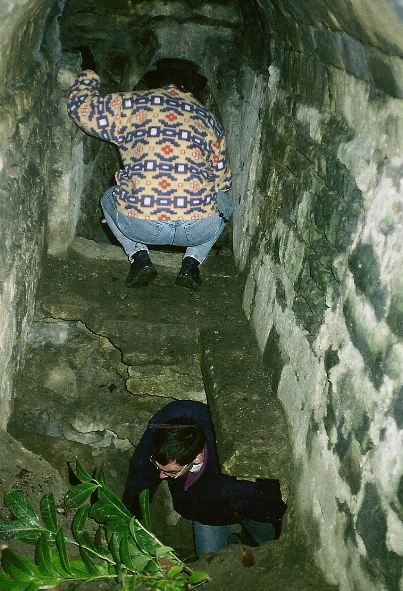 CART CIO Dr WIll Ward passing through the tunnel into the main Ice House chamber, with Mrs Ward looking into it from above. 