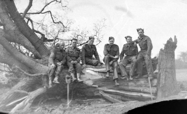 Sgt. Dickerson 1st left. Geoffrey Newman 4th from left with the Allen brothers either side. Maybe Percy Winterbone far right. Having blown over the tree.