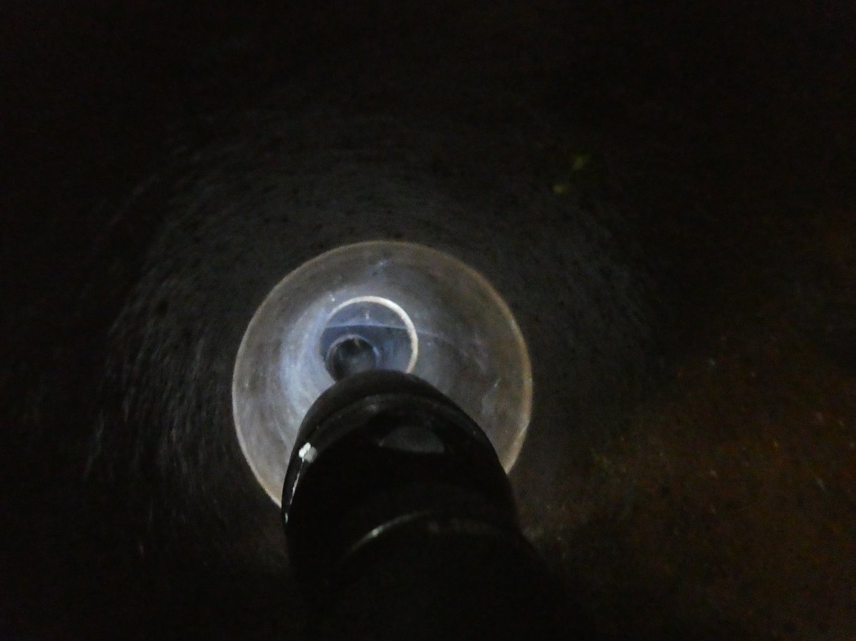 The first pipe run seen from the OB side and illuminated with a torch. The height suggests it may have connected to the top of the main chamber.