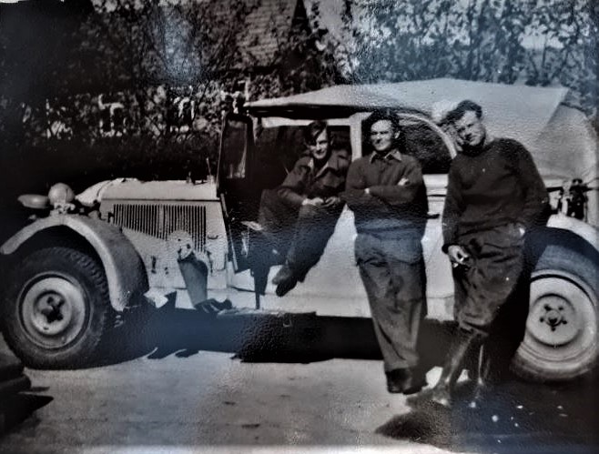 Taken in front of a captured German staff car, Louis Henry Baker SAS in centre 